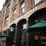 Starbucks Coffee storefront in a brick building