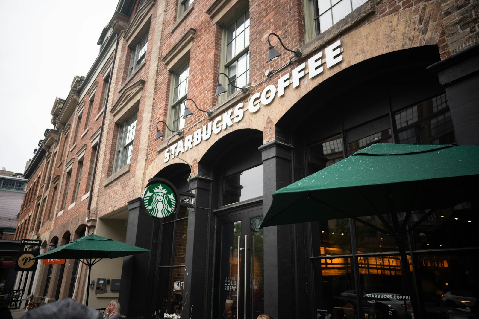 Starbucks Coffee storefront in a brick building